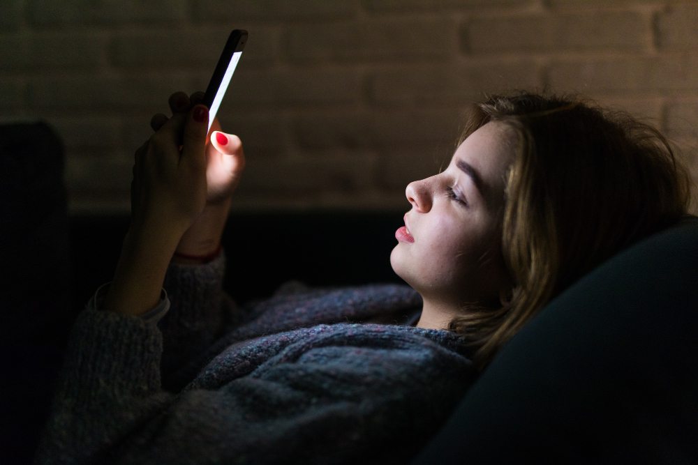 young-beautiful-woman-using-smart-phone-night-bed-technology-social-network-insomnia-concept-1