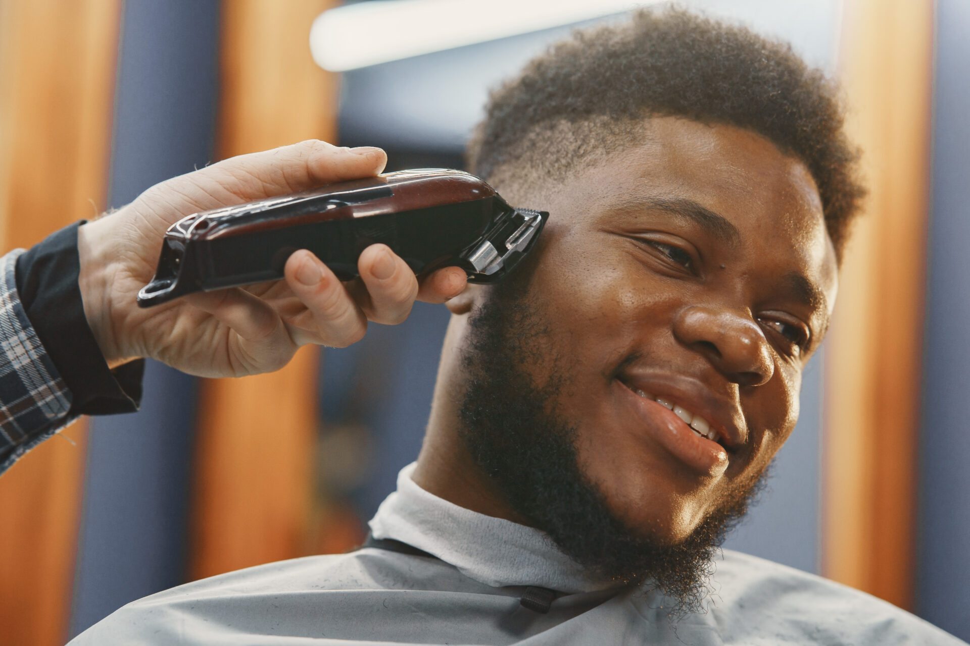 young-african-american-man-visiting-barbershop-1920x1280